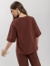 Blusa em algodão com mangas médias e argola frontal